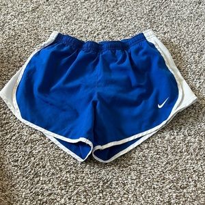 Nike blue and white running shorts, size M kids
